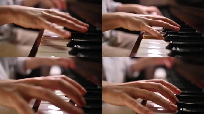 一位年轻女子弹奏复古钢琴的手特写。