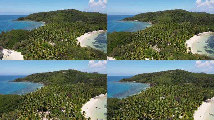 斐济的原始热带岛屿，有着令人惊叹的绿松石水、珊瑚礁、棕榈树和白色沙滩。