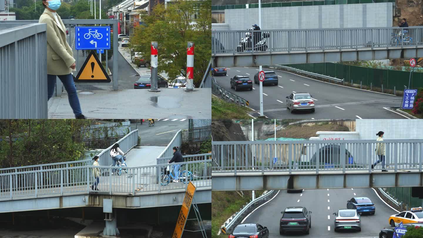 道路施工临时天桥上的行人电动车