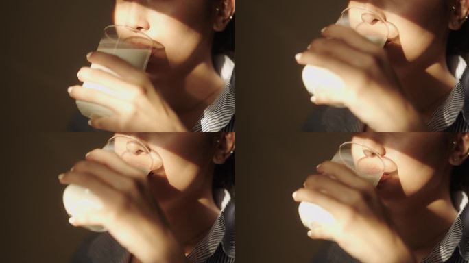 一个女人喝牛奶的特写镜头