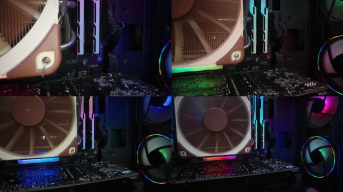 电脑组件和RGB照明内部脉动与彩虹的颜色。多莉滑块极端特写。