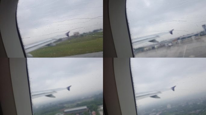 雨中起飞时飞机窗面上的雨滴