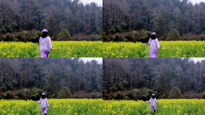（慢镜）油菜花田地里奔跑的少女背影