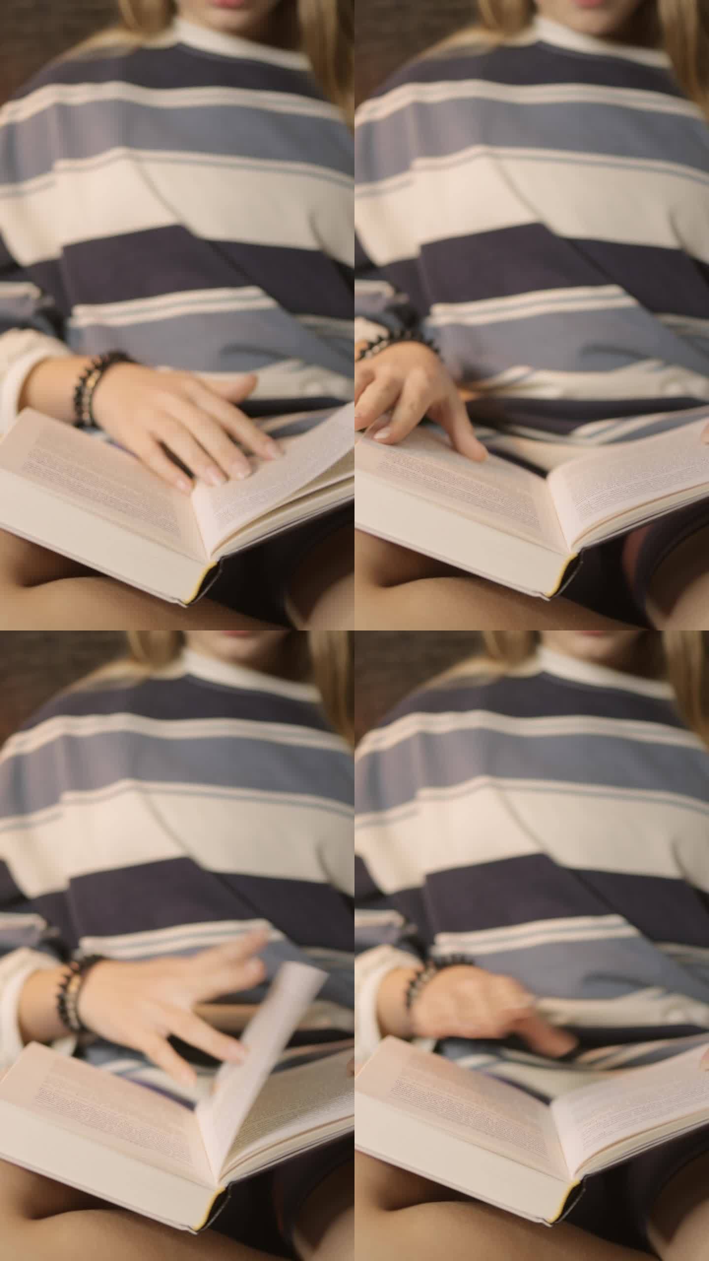 一个特写镜头聚焦在一个十几岁的女孩翻阅一本书的时候，突出了书封面的细节和女孩对书中的内容的参与。垂直