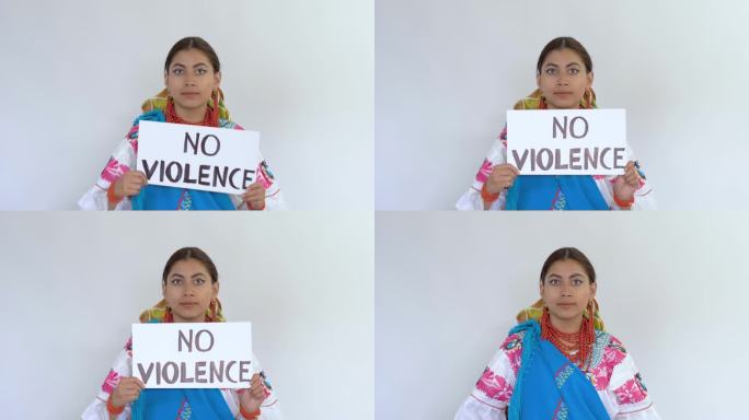 一个年轻的黑发拉丁女孩穿着名为Cayambeñas的传统服装，展示了一条“禁止暴力”的信息。