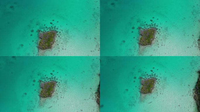 无人机在斐济礁湖的小岩石岛上盘旋