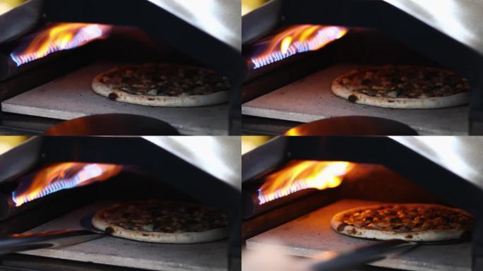 比萨是在烤箱里近火烤的。