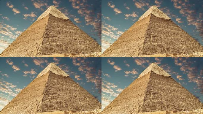 埃及开罗吉萨，高耸的切芬金字塔，背景是乌云密布的天空。