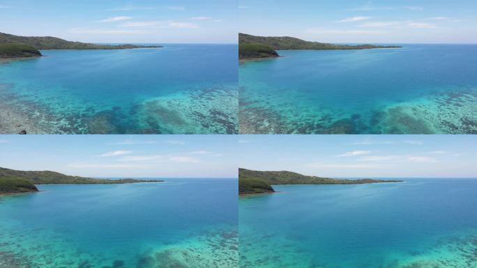 从空中可以看到的Yasawa群岛的珊瑚礁。珊瑚礁为水的鲜艳色彩做出了贡献，从浅海的浅蓝和绿色到开阔海