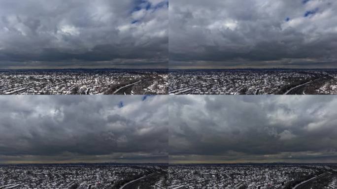 阴天，纽约长岛郊区上空的灰色云层。当云层接近时，无人机摄像机在附近的高空移动。