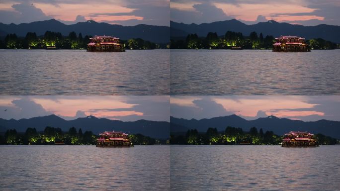 黄昏日暮时的中国杭州西湖和湖面上的游船
