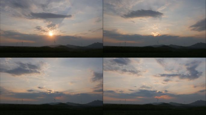 太阳穿云落日风车转动田野山丘夕阳延时