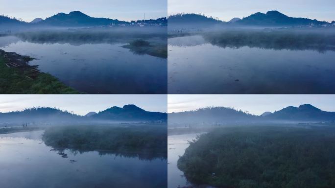 雾蒙蒙的河流景观在黎明与山在背景和反射的水。迪昂高原山，印度尼西亚。