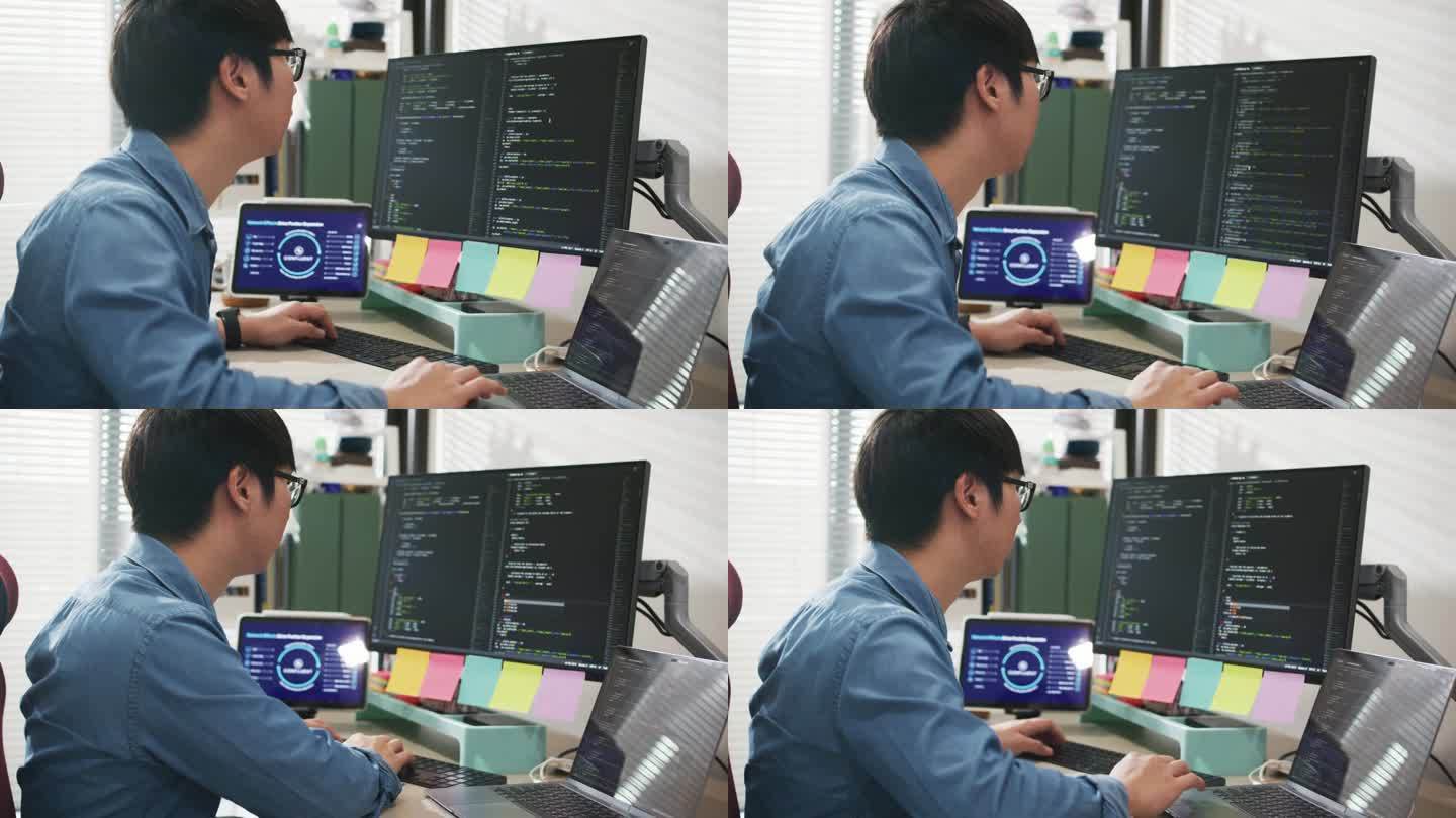 男性开发人员在台式电脑上改进代码