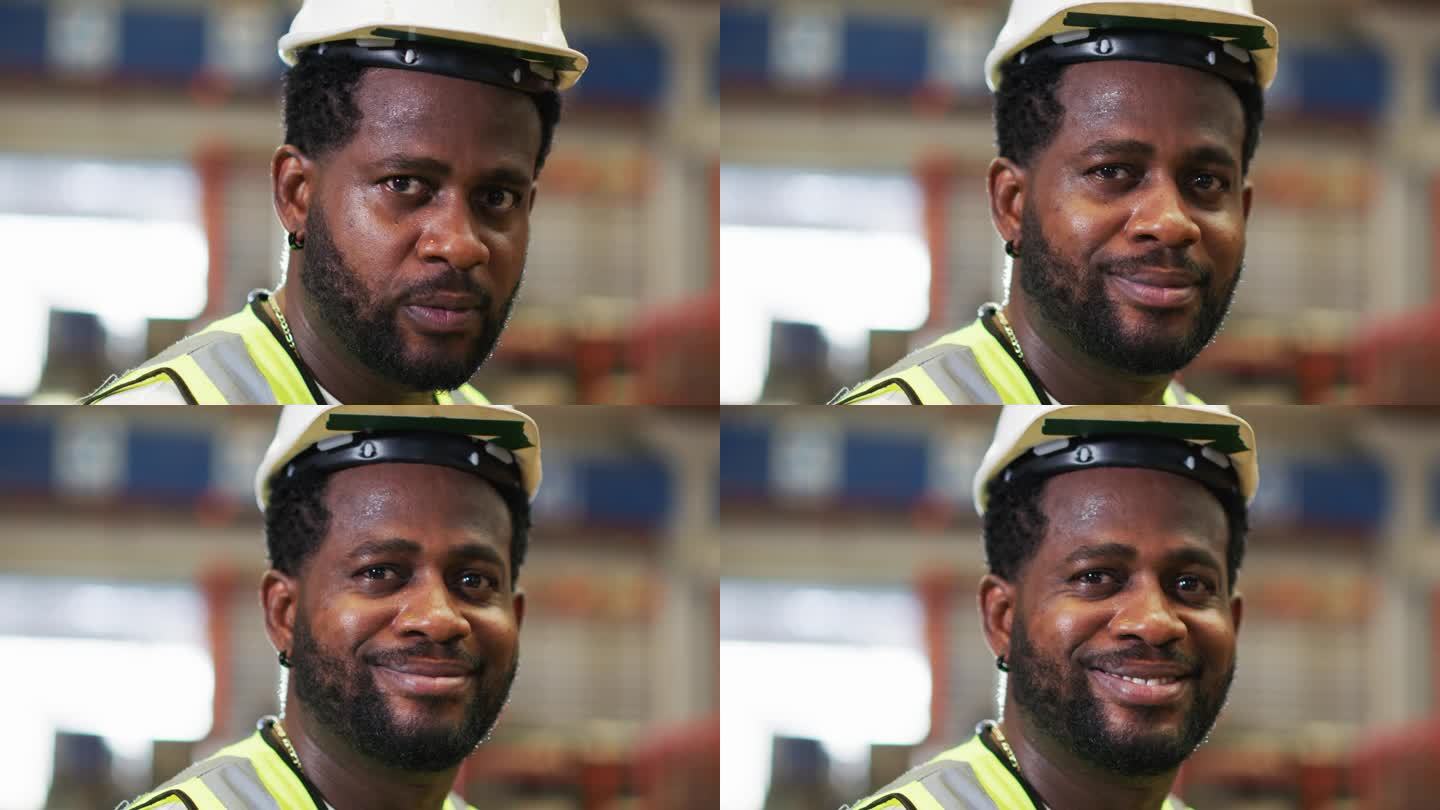 专业金属机械工业工程师，头戴安全帽，面带微笑，自信地站在车间工厂里