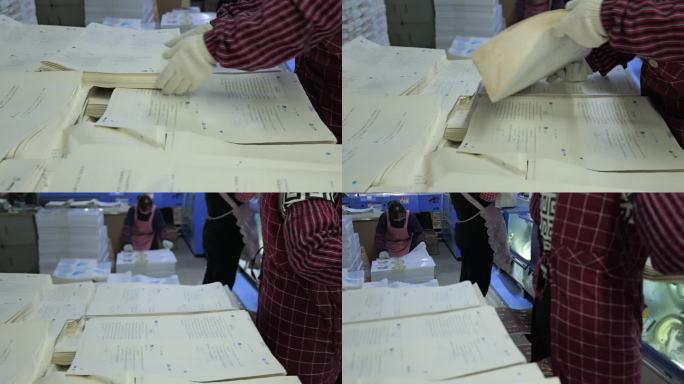 印刷厂里工人在整理印刷的试卷5