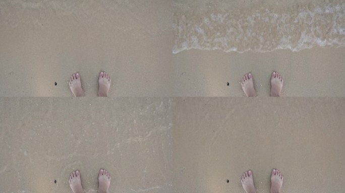 慢动作场景，近距离拍摄赤脚在夏季海上旅行的沙滩上