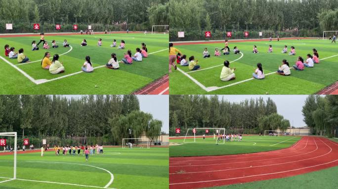 农村学校的孩子们在操场做游戏 踢足球