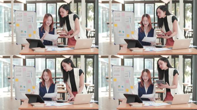 年轻的女商人在项目办公空间用平板电脑和打印图表一起工作和头脑风暴。