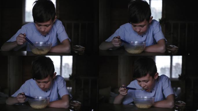 品味营养:男孩晚上在家喝汤的特写