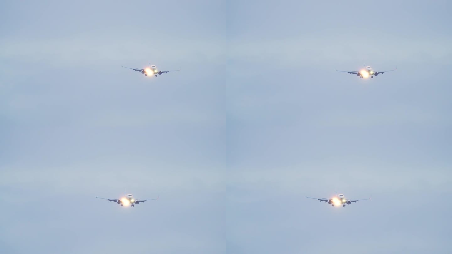 前视图飞行喷气式客机。飞机抵达机场并在黄昏降落