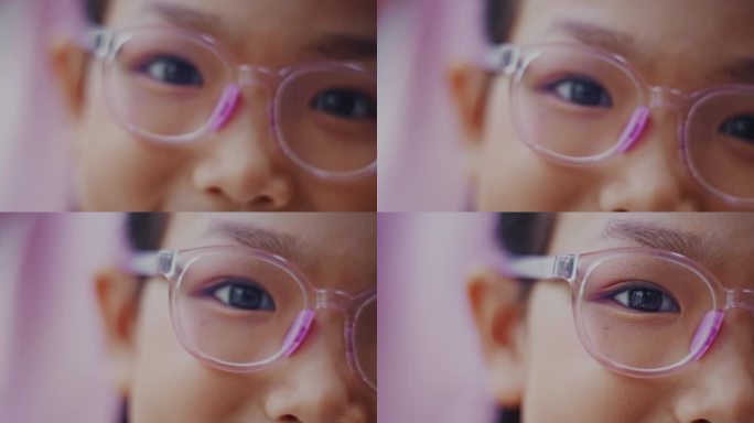 戴眼镜的亚洲少女粉色眼眶