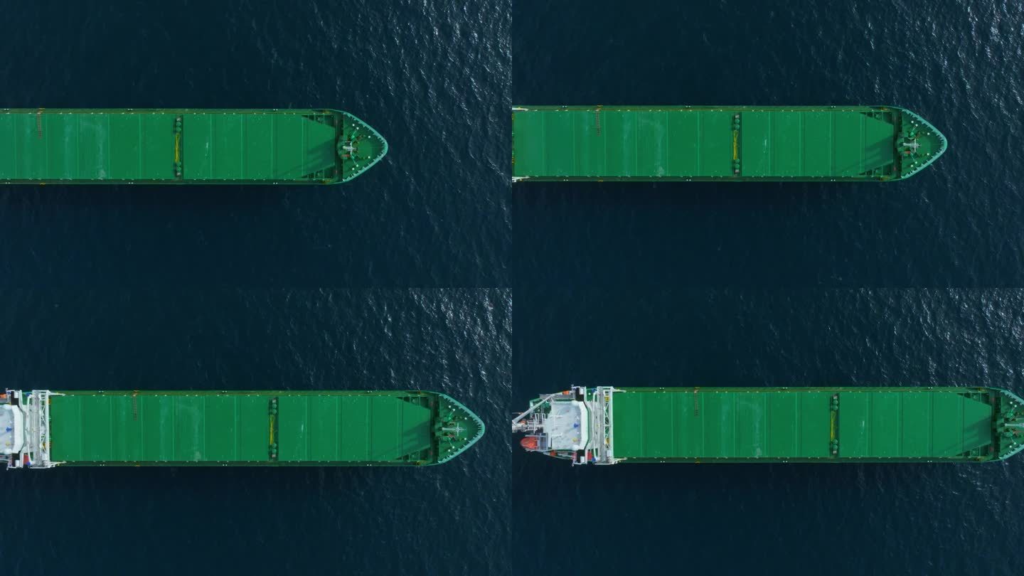 从上向下鸟瞰停泊在海上的绿色大型杂货船