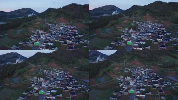鸟瞰图，一个村庄在黎明的薄雾中，周围是田野和山丘。迪昂高原山，印度尼西亚。
