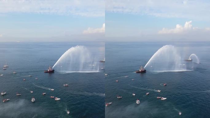 鸟瞰马尔马拉海上的船只和船只，庆祝土耳其共和国成立一百周年。船在打转，船在喷水。