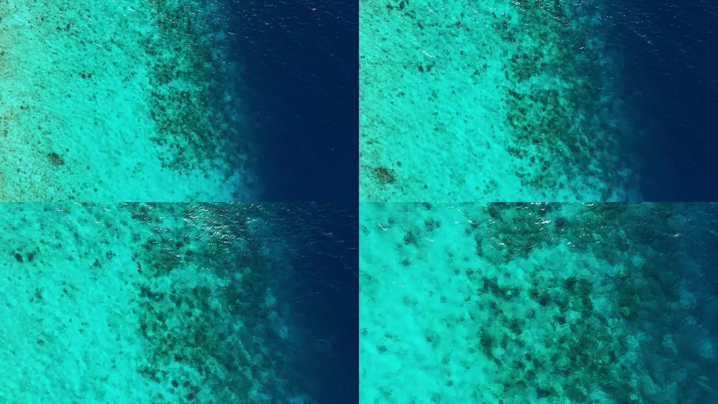 沙质珊瑚礁沉入深海，无人机降落在水面上