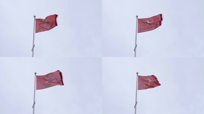 马恩岛州和市民旗在道格拉斯市的旗杆上挥舞