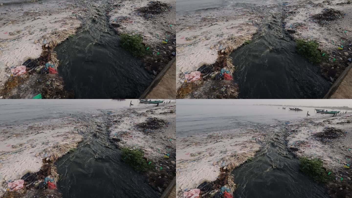 摇上。臭气熏天的污水和塑料污染流入海洋。