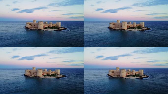在航拍镜头中见证令人惊叹的基兹卡莱西:日落时分，地中海沿岸梅尔辛的一座12世纪拜占庭城堡遗址。体验基