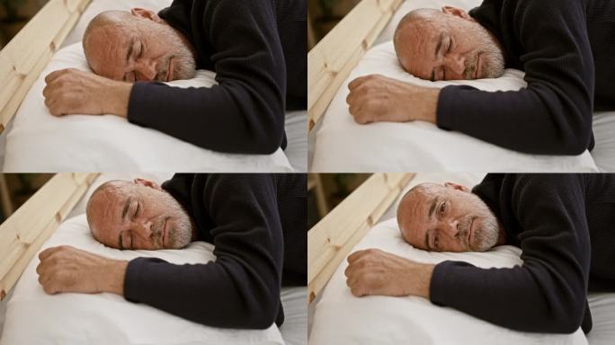 有胡子的秃顶老人安详地睡在床上，在家里，描绘了放松和宁静。