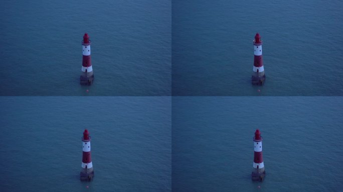 海上的红白灯塔:黄昏闪烁的光芒。