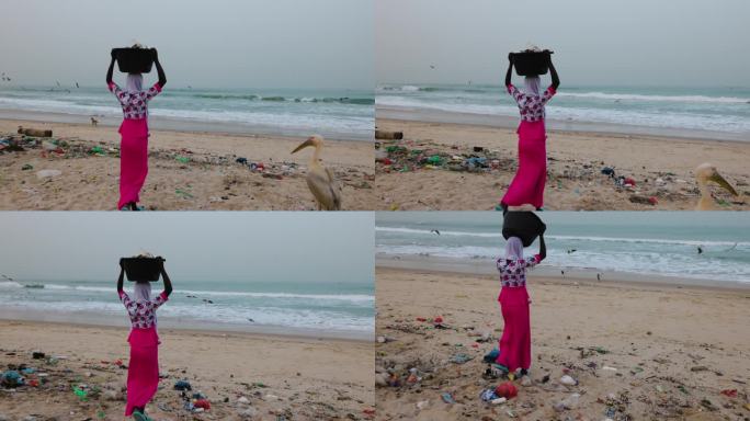 非洲黑人妇女在海边倾倒垃圾。可怕的塑料污染。