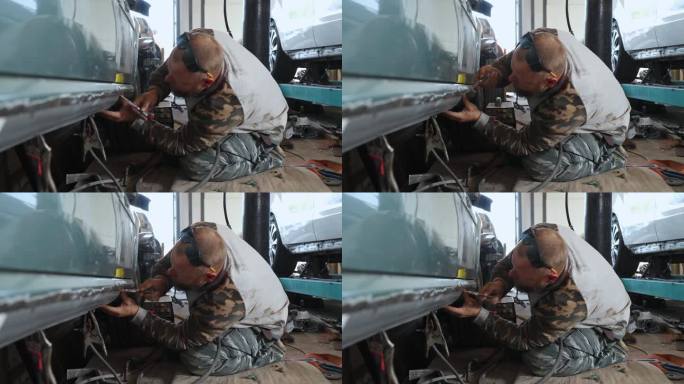 机械师修理汽车门阀。
