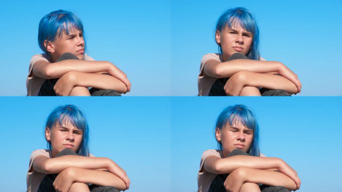 忧郁的蓝头发少年。
