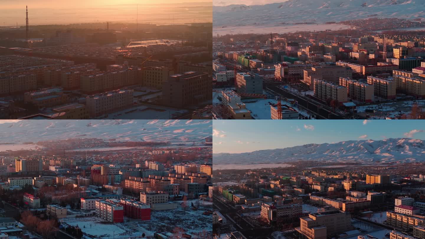 新疆昭苏冬季城市雪山航拍日出日落0021
