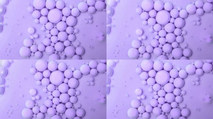 紫色浮泡在油基上。丙烯酸涂料。抽象的背景。