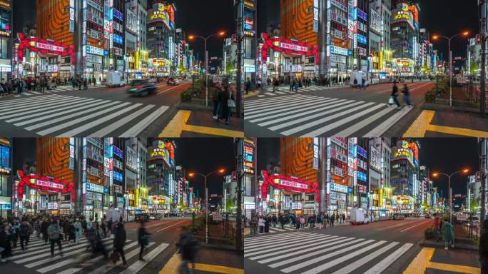 在日本东京新宿，人们穿过歌舞伎町门前繁忙的街道