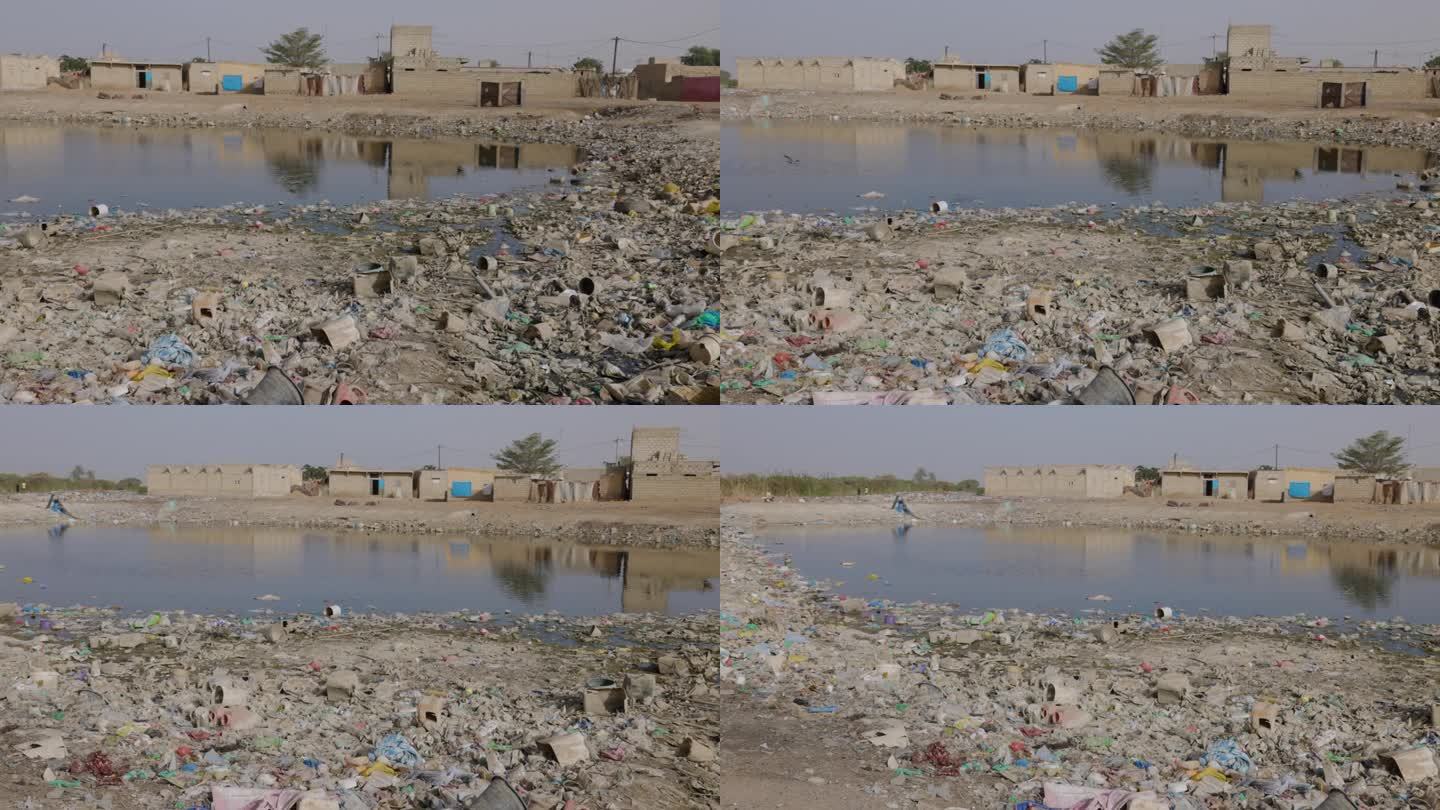特写镜头平移。恶臭的污水和可怕的塑料污染达喀尔，塞内加尔
