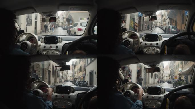 一位母亲在城市里开车，她的男婴坐在安全座椅上