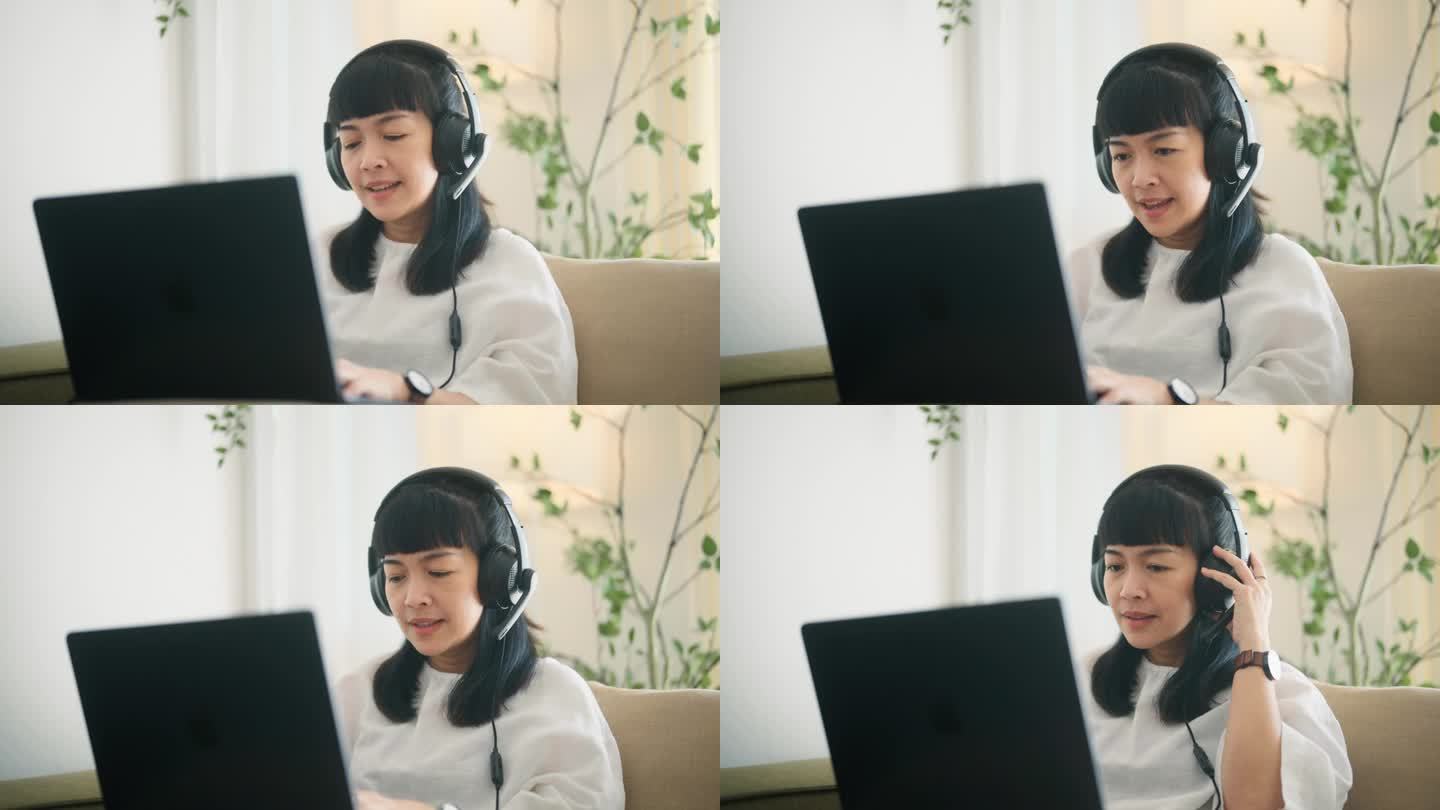 亚洲女商人度假时在家用笔记本电脑开视频会议