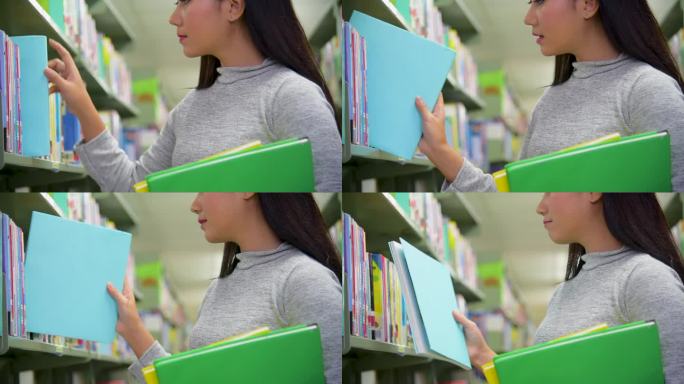 亚洲妇女在大学图书馆的书架前举着书阅读。年轻女子放松地翻开书本自习。大学女生在图书馆书店自学。教育学