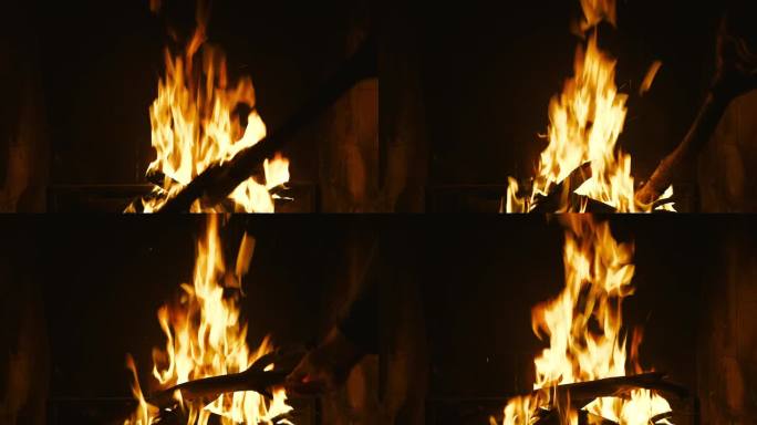 壁炉里的火，一个人把火里的煤弄直，这是火的自然光
