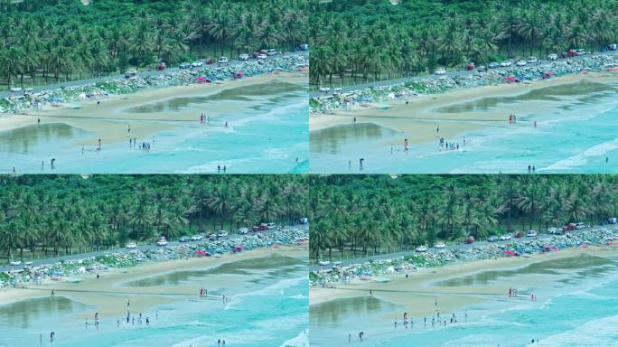 海南万宁海边冲浪的人们