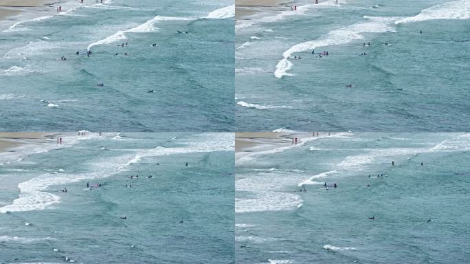 海南万宁海边冲浪的人们