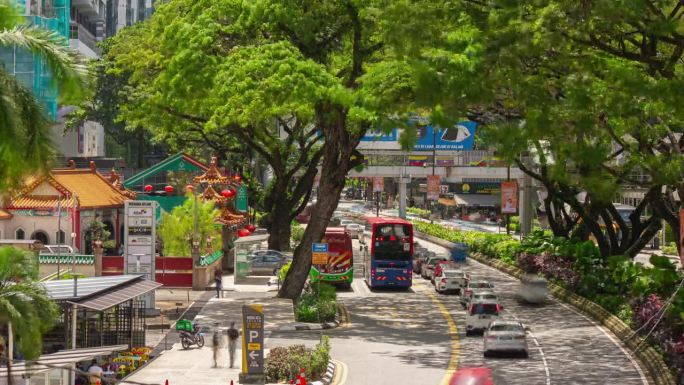 阳光明媚的一天，吉隆坡市中心宝塔外部交通街道路桥顶部全景4k延时马来西亚