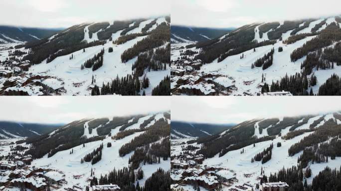 晴朗多雾的云层冬天多雪的清晨日出空中无人机科罗拉多铜山滑雪胜地i70鹰飞人升降机中心村单板滑雪半管伊